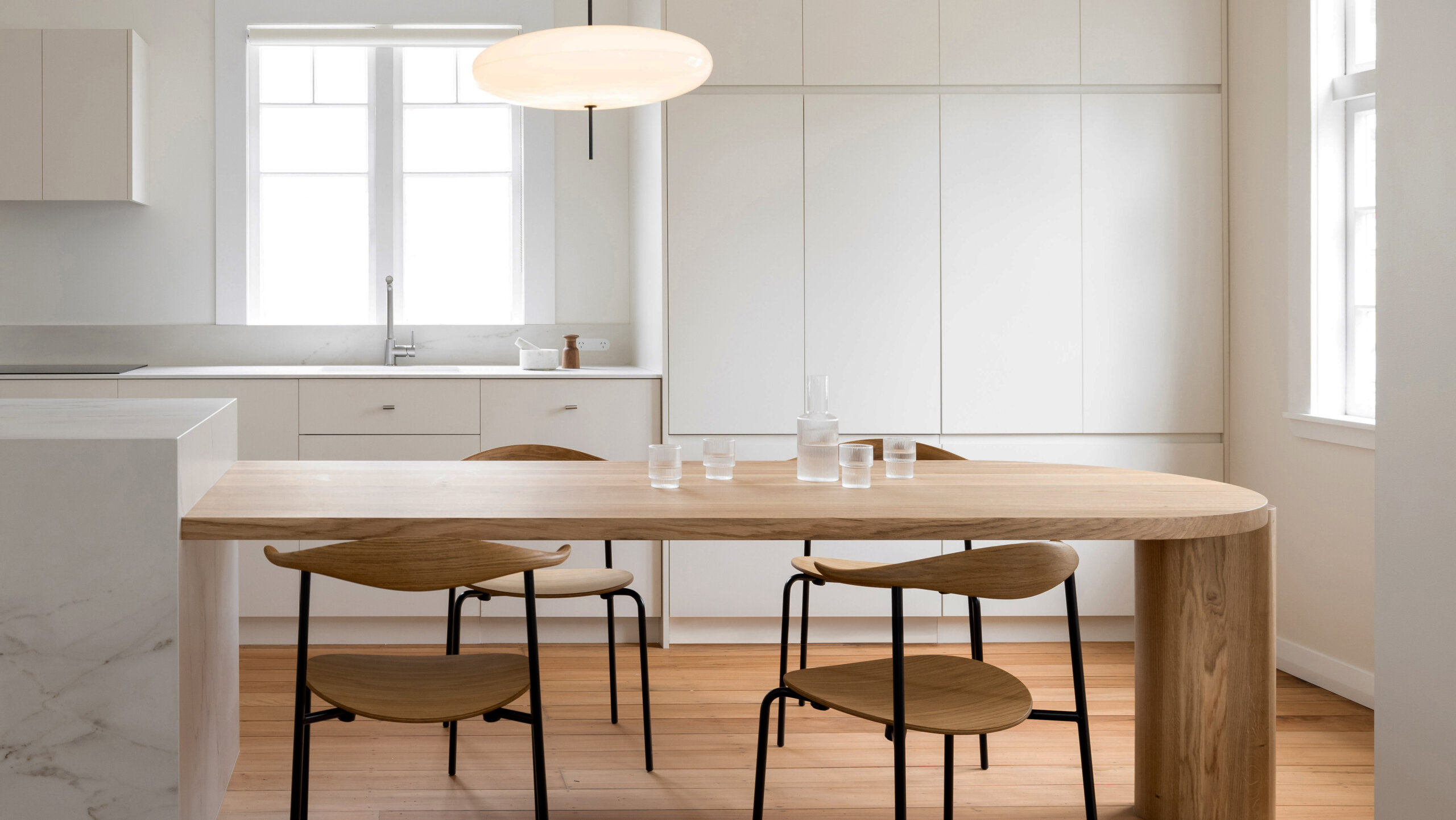 custom scandinavian style kitchen design with cantilevered timber and stone island